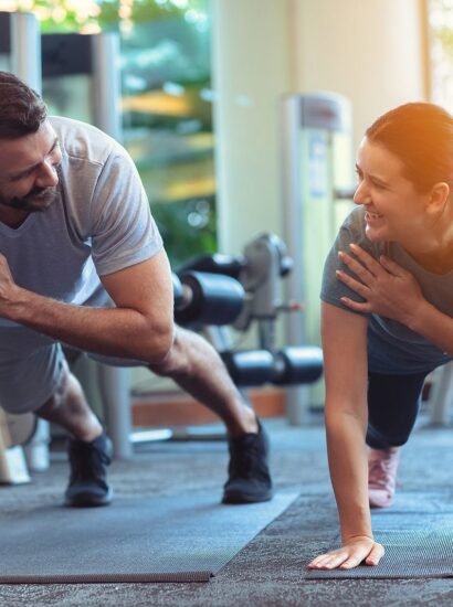 bigstock-Couple-Exercise-Together-In-Gy-368616523
